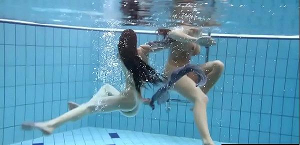  Shaved brunette with big tits underwater